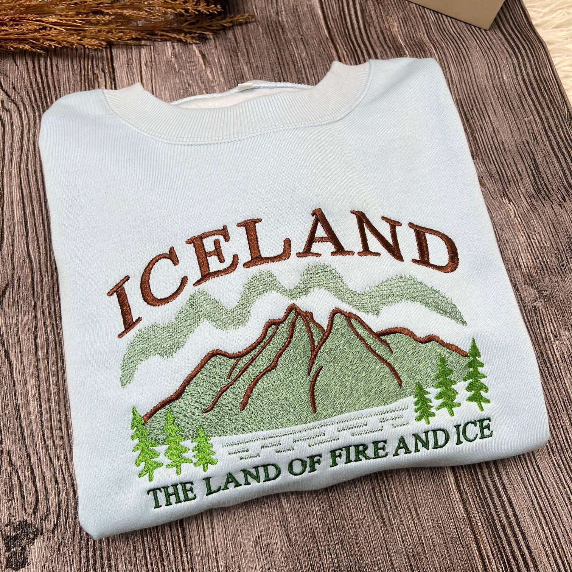 Iceland Embroidered Sweatshirt, Land of Fire and Ice Crewneck, Nordic Travel Sweater, Adventure Gift, Cozy Winter Travel Shirt